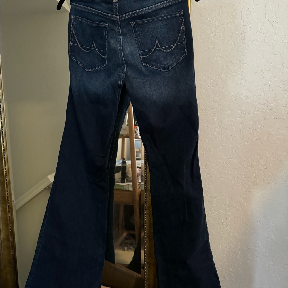 Ariat flare jeans, mid rise. Flattering to the body and great over boots!